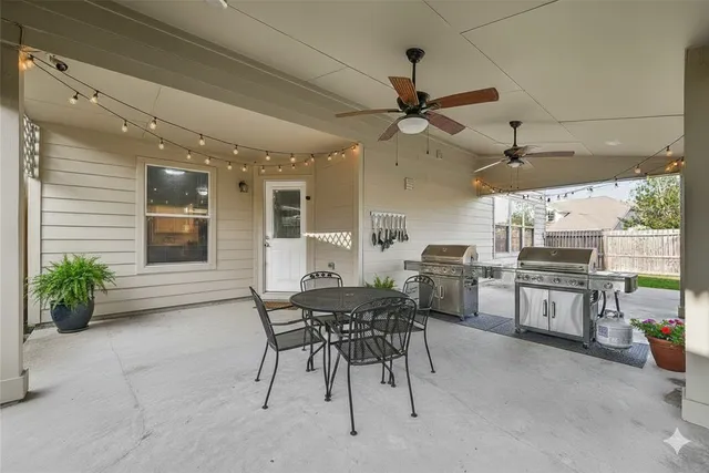 a view of a dining room with furniture and window