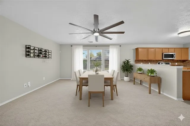 a dining room with furniture and window