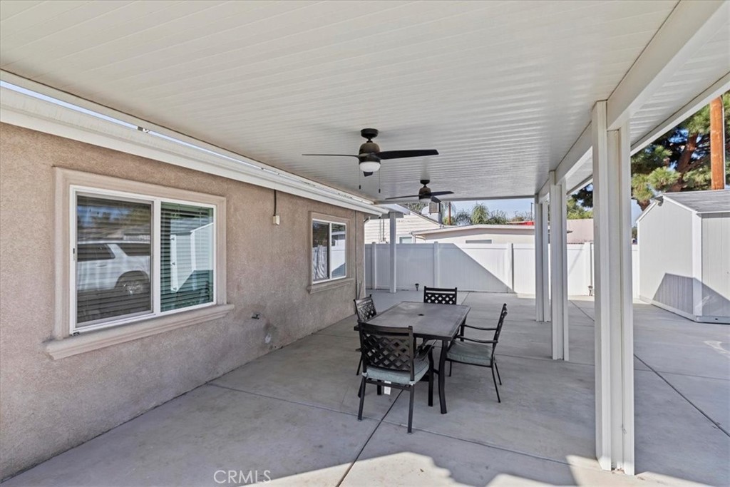 19594 Temescal Canyon Road Corona, CA 92881 - Photo 15 of 50 a view of a dining room with furniture and a chandelier