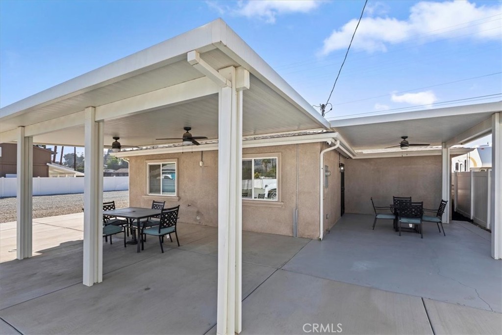 19594 Temescal Canyon Road Corona, CA 92881 - Photo 16 of 50 a view of dining room with chairs and front door