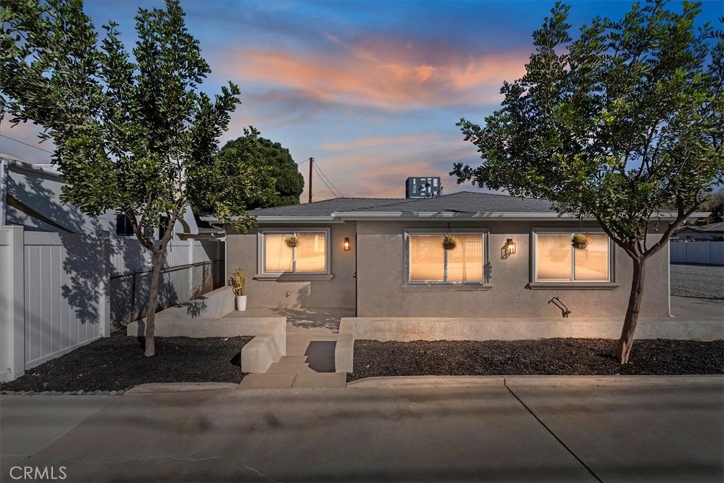 19594 Temescal Canyon Road Corona, CA 92881 - Photo 4 of 50 a front view of a house with yard garage and tree