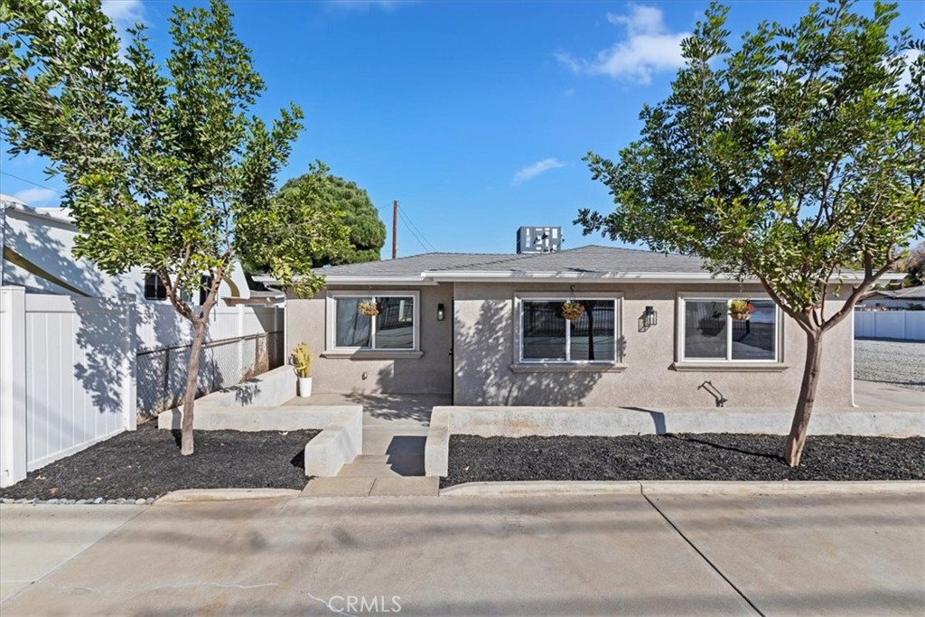 19594 Temescal Canyon Road Corona, CA 92881 - Photo 6 of 50 a front view of a house with a yard