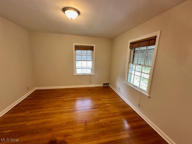 4065 Conover Road Cleveland, OH 44118 - Photo 14 of 24 Spare room with hardwood / wood-style flooring and a wealth of natural light