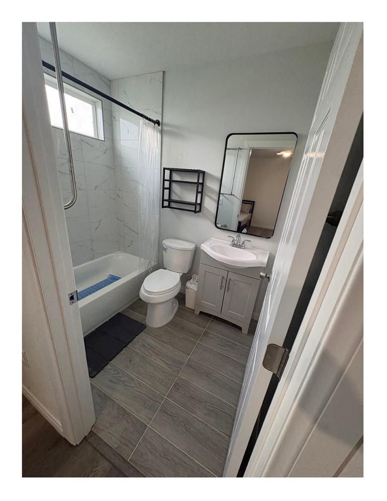 720 West Cherry Street Compton, CA 90222 - Photo 20 of 32 a bathroom with a sink a toilet and shower