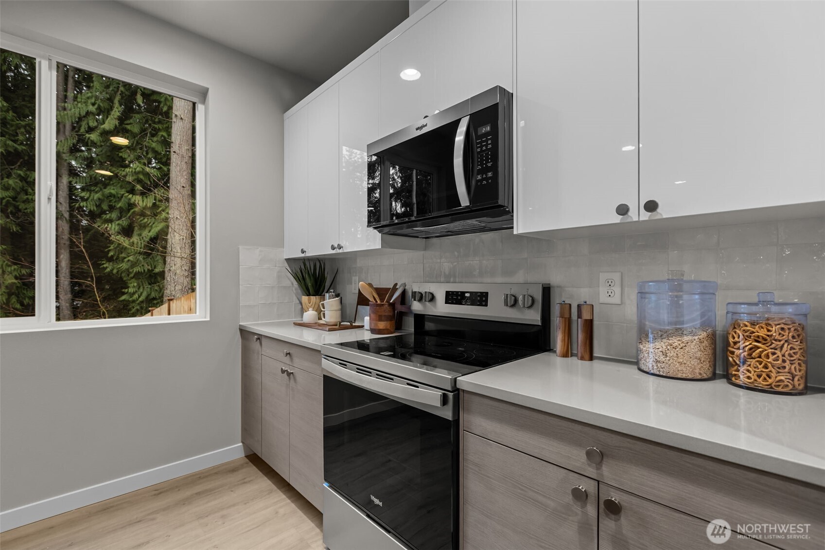 110 169th Place Southwest, Unit A Bothell, WA 98012 - Photo 11 of 29 a kitchen with a stove and a white cabinets