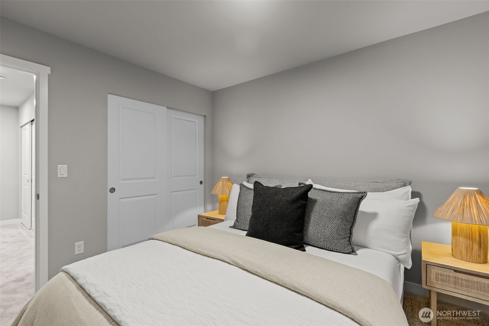 110 169th Place Southwest, Unit A Bothell, WA 98012 - Photo 24 of 29 a bedroom with a bed and a lamp