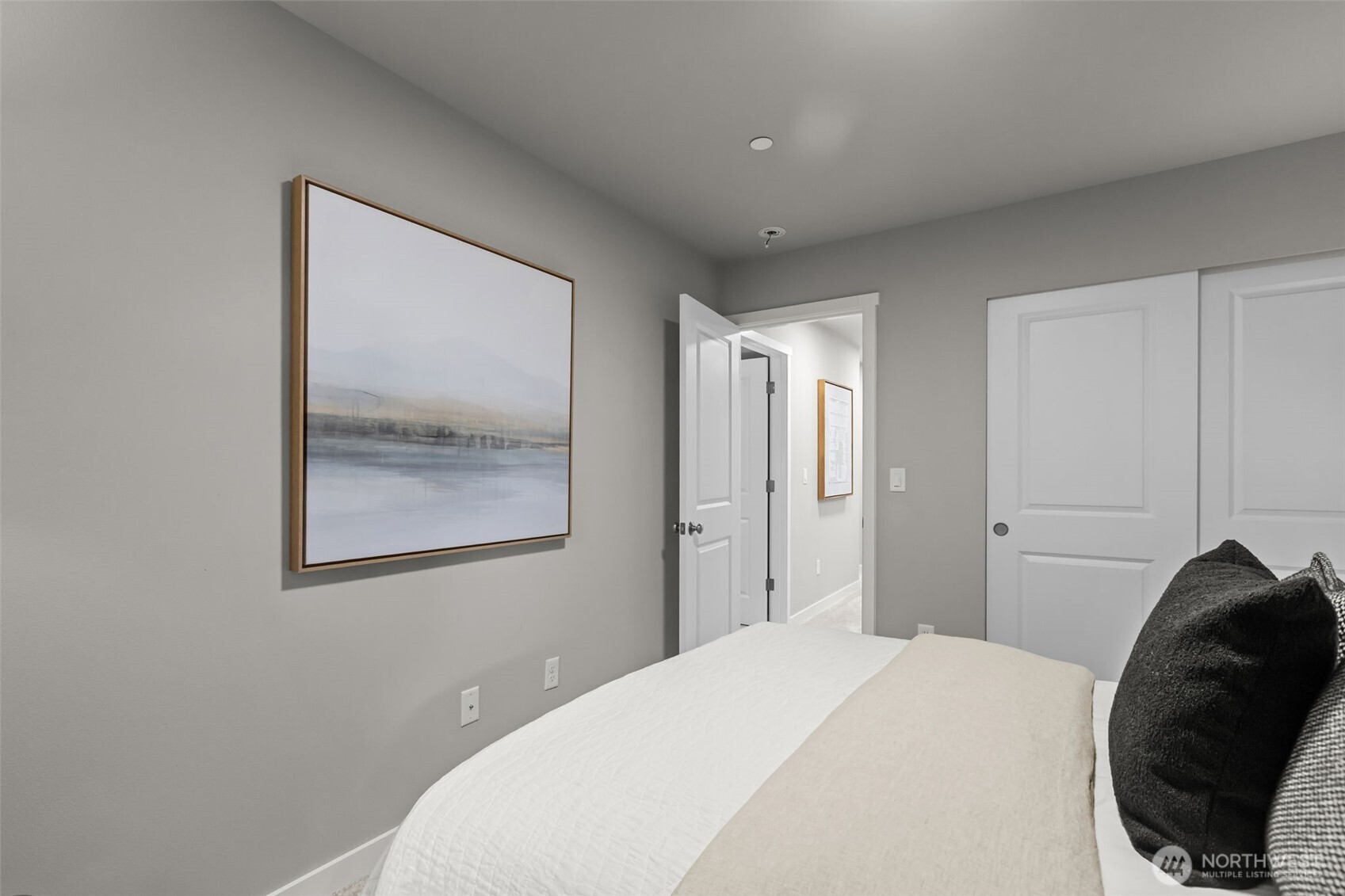 110 169th Place Southwest, Unit A Bothell, WA 98012 - Photo 25 of 29 a bedroom with a bed and a painting on the wall
