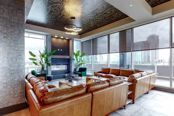 a view of a kitchen with furniture and a potted plant