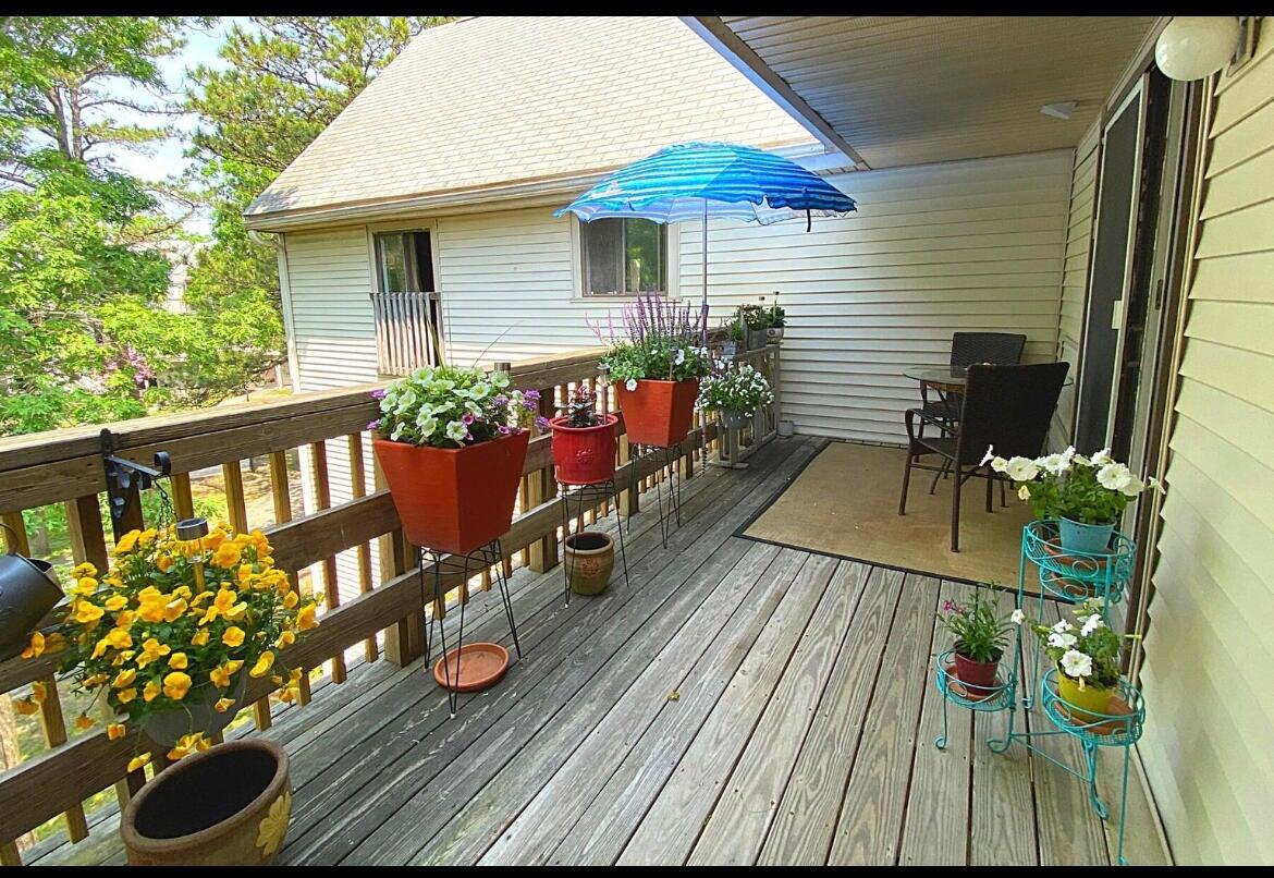 a view of a deck with wooden floor