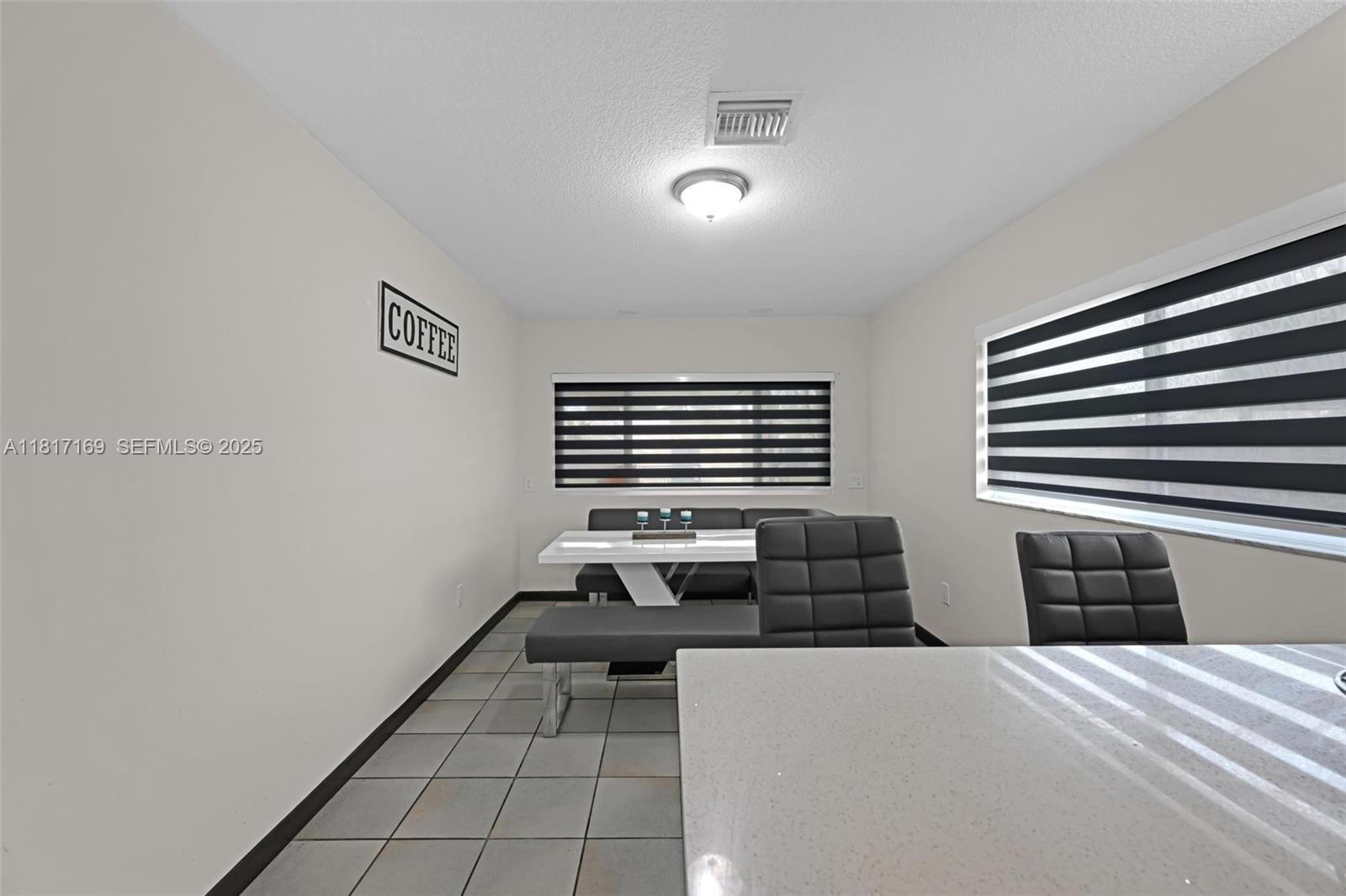 30930 Southwest 190th Avenue Homestead, FL 33030 - Photo 11 of 36 a bedroom with furniture and a window
