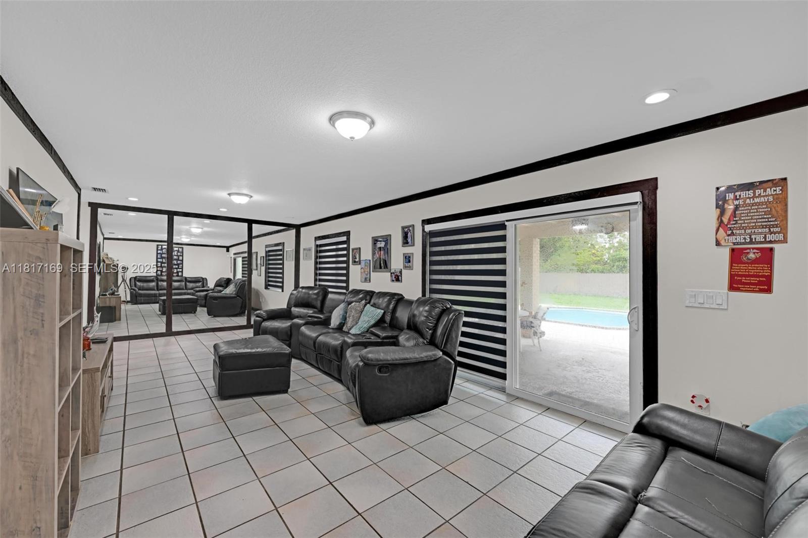 30930 Southwest 190th Avenue Homestead, FL 33030 - Photo 12 of 36 a living room with furniture and a flat screen tv