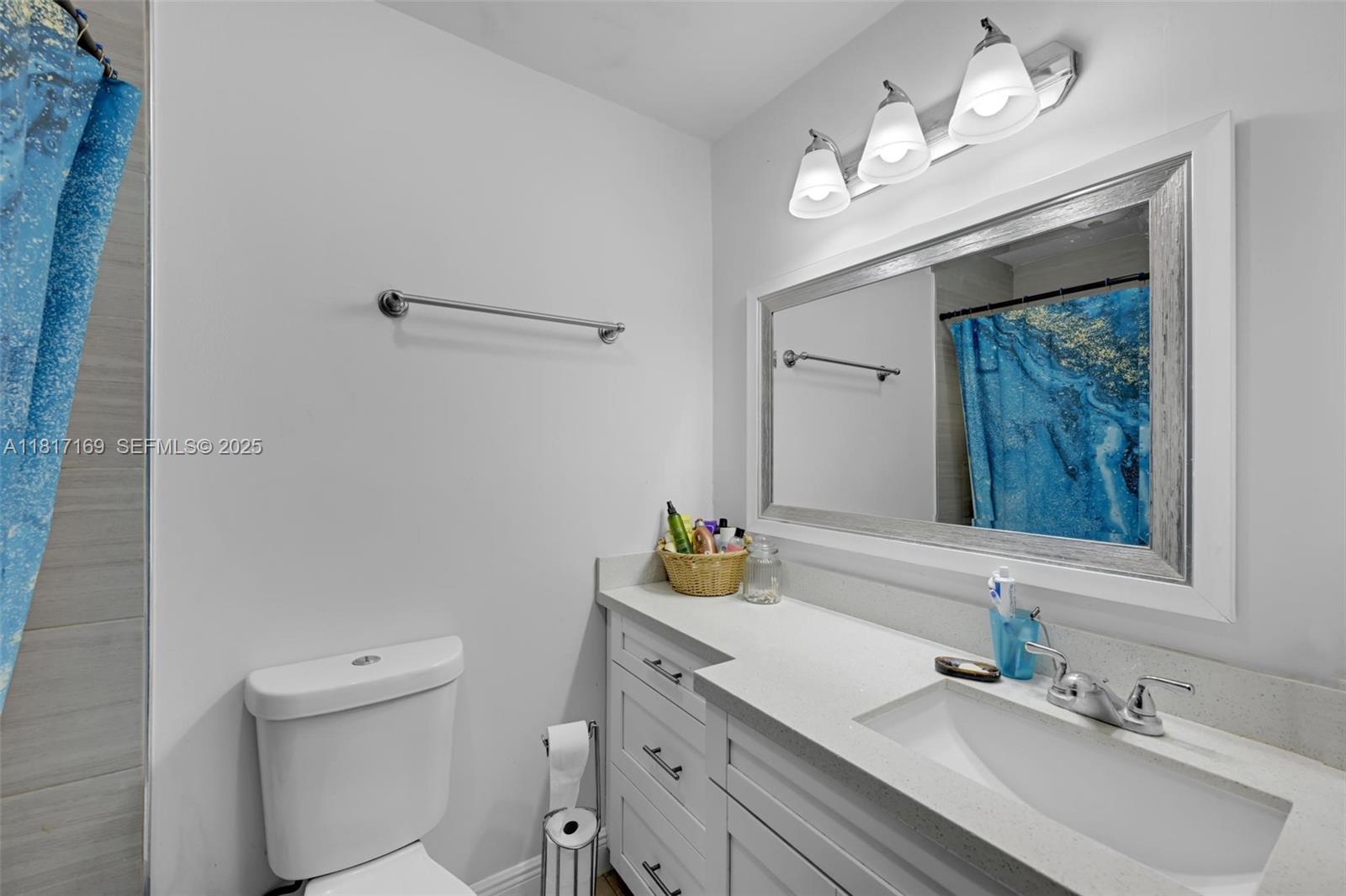 30930 Southwest 190th Avenue Homestead, FL 33030 - Photo 14 of 36 a bathroom with a sink a vanity and a mirror
