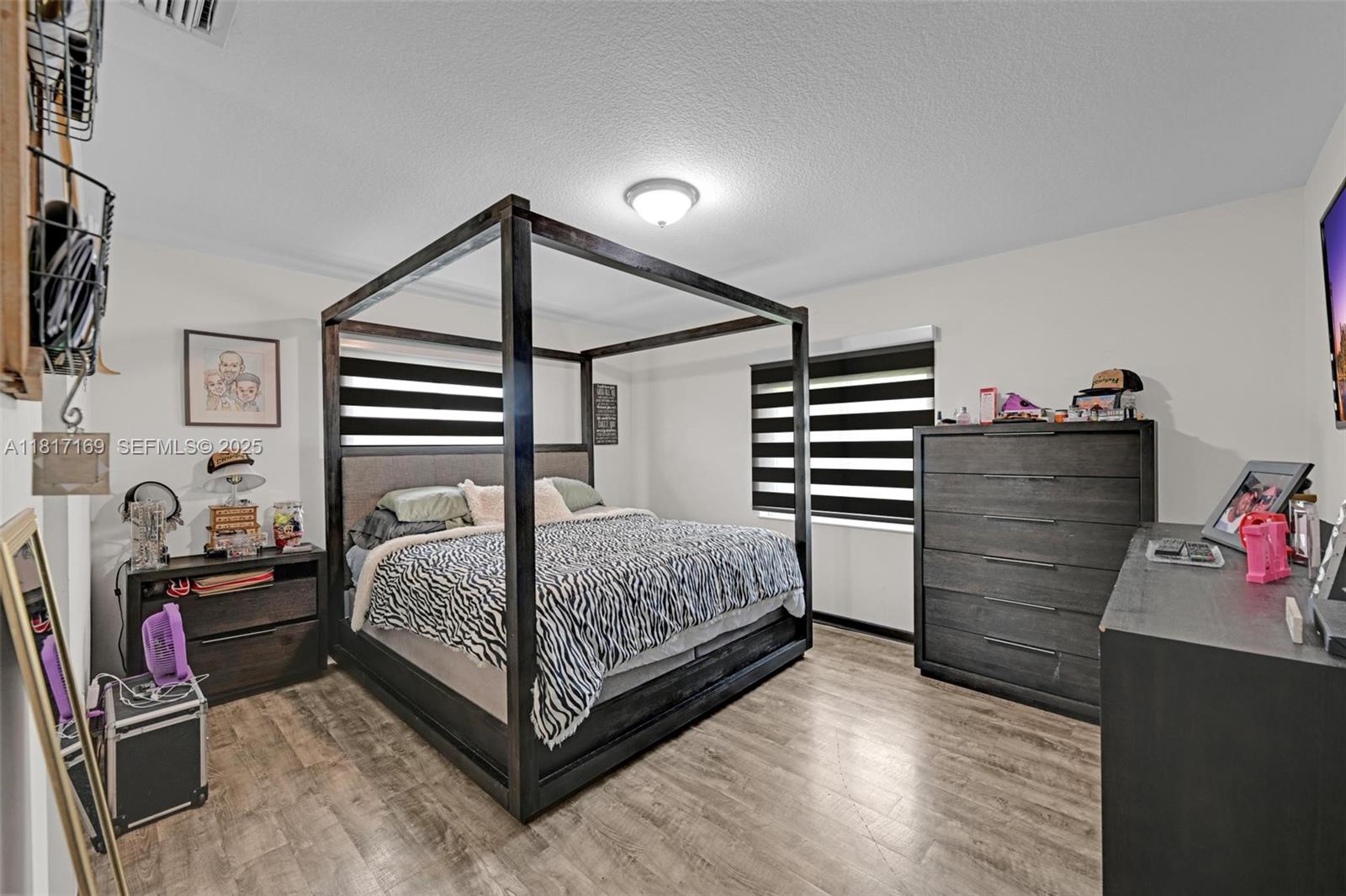 30930 Southwest 190th Avenue Homestead, FL 33030 - Photo 15 of 36 a bedroom with a bed and a closet