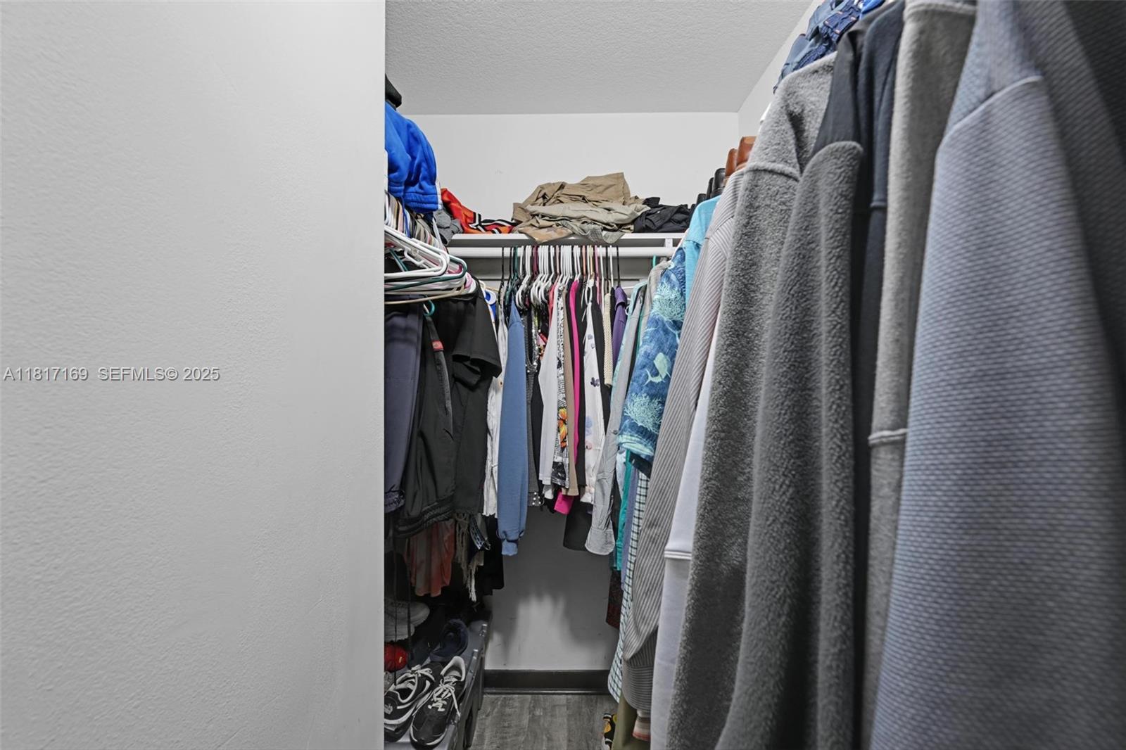 30930 Southwest 190th Avenue Homestead, FL 33030 - Photo 19 of 36 a view of walk in closet with clothes
