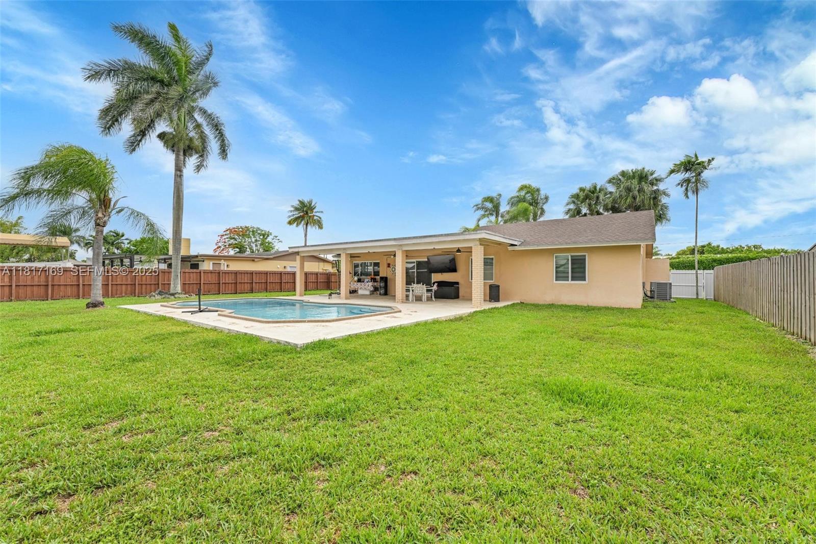 30930 Southwest 190th Avenue Homestead, FL 33030 - Photo 24 of 36 a view of a house with a backyard