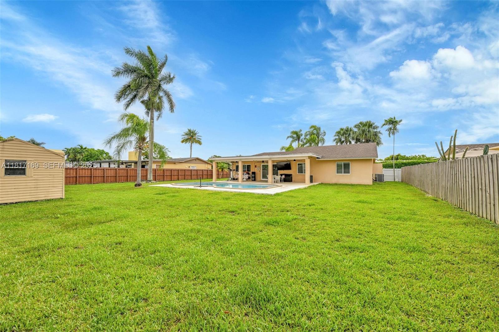 30930 Southwest 190th Avenue Homestead, FL 33030 - Photo 25 of 36 a view of a house with a big yard