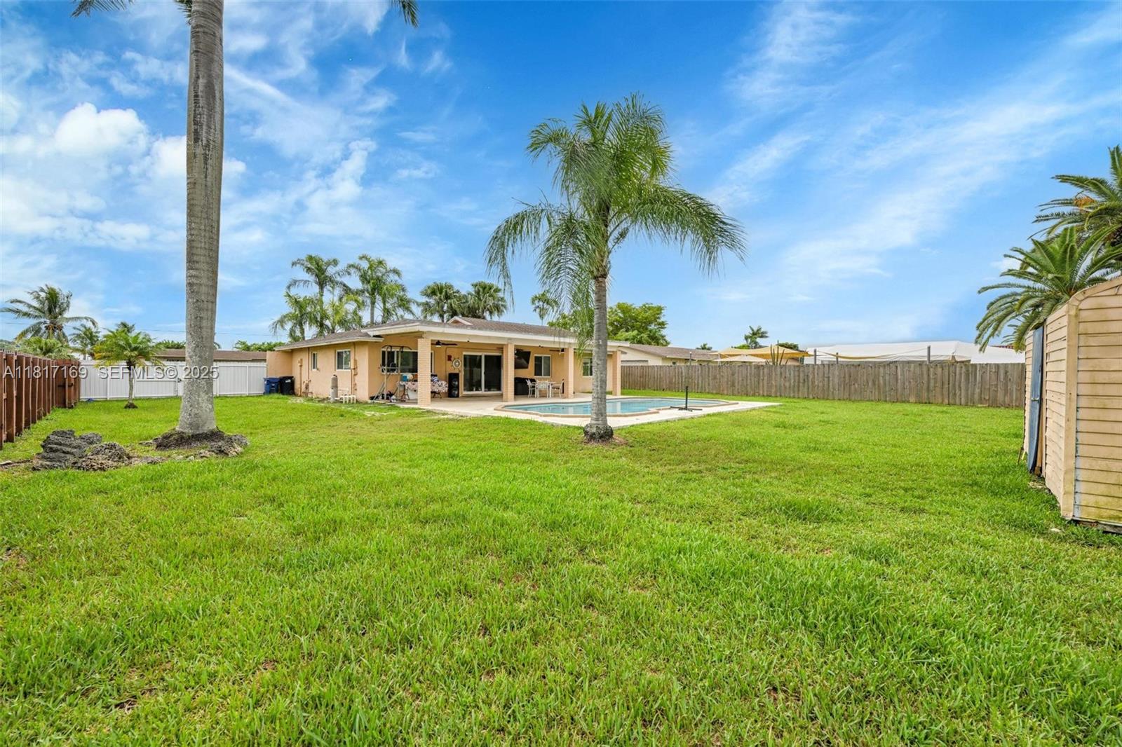 30930 Southwest 190th Avenue Homestead, FL 33030 - Photo 27 of 36 a view of a house with a big yard