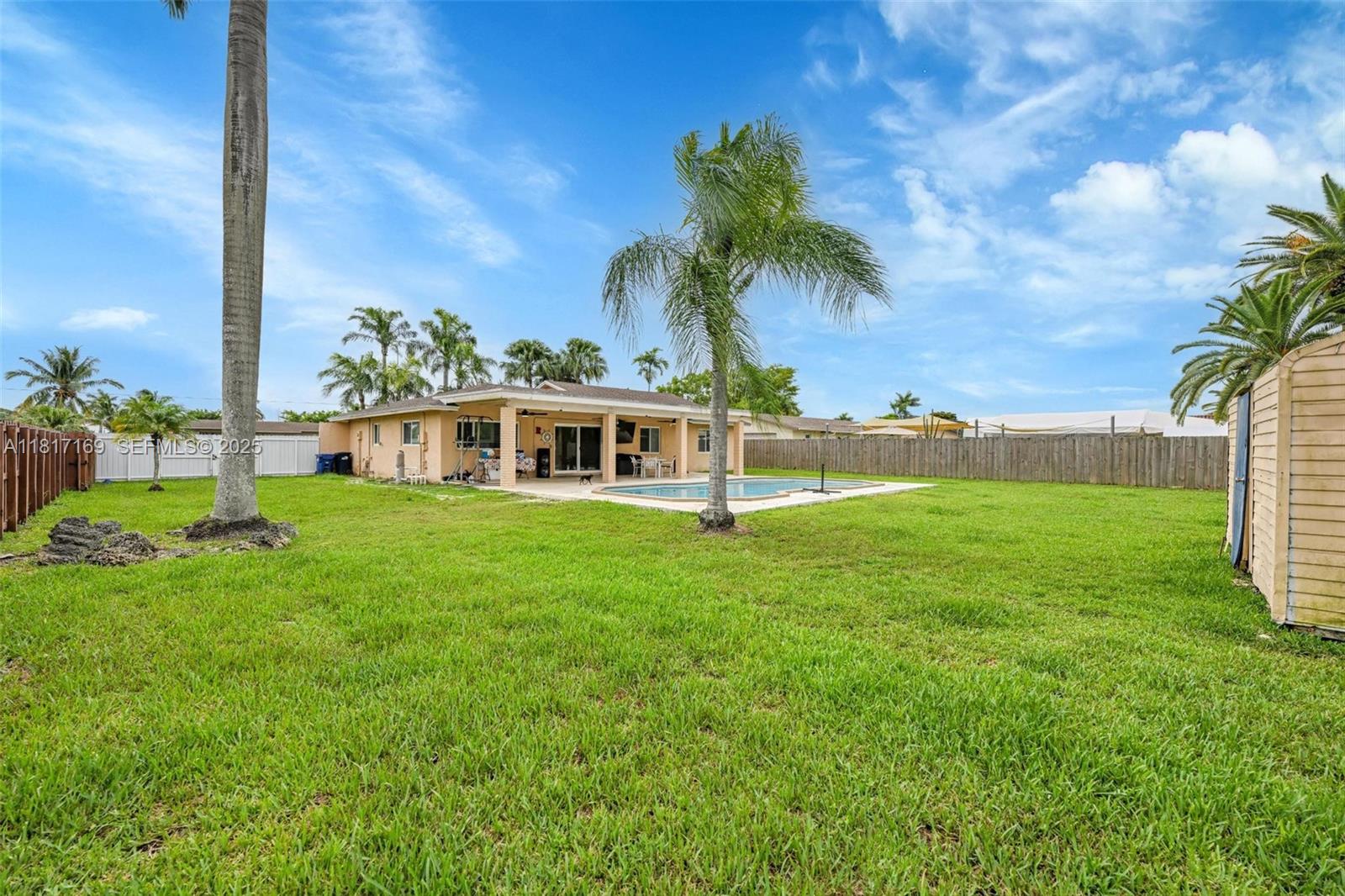 30930 Southwest 190th Avenue Homestead, FL 33030 - Photo 28 of 36 a view of a house with a big yard