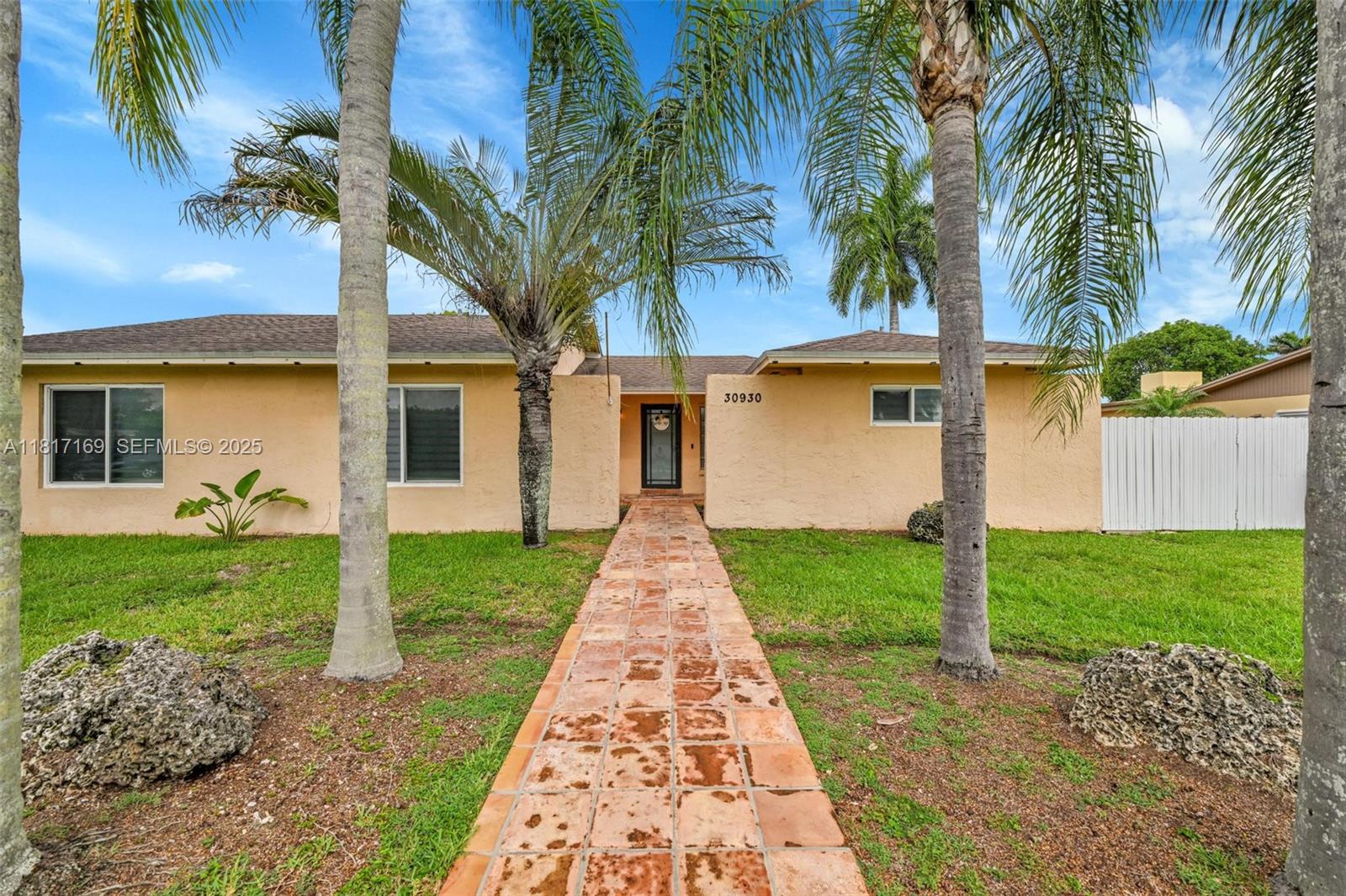 30930 Southwest 190th Avenue Homestead, FL 33030 - Photo 3 of 36 a view of a yard with a house