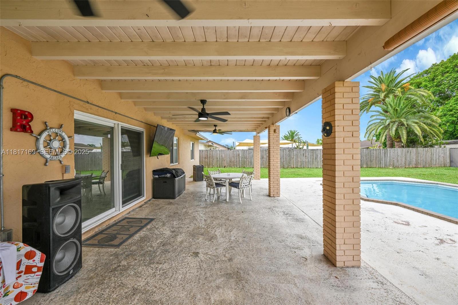 30930 Southwest 190th Avenue Homestead, FL 33030 - Photo 31 of 36 a view of a porch with furniture and a backyard