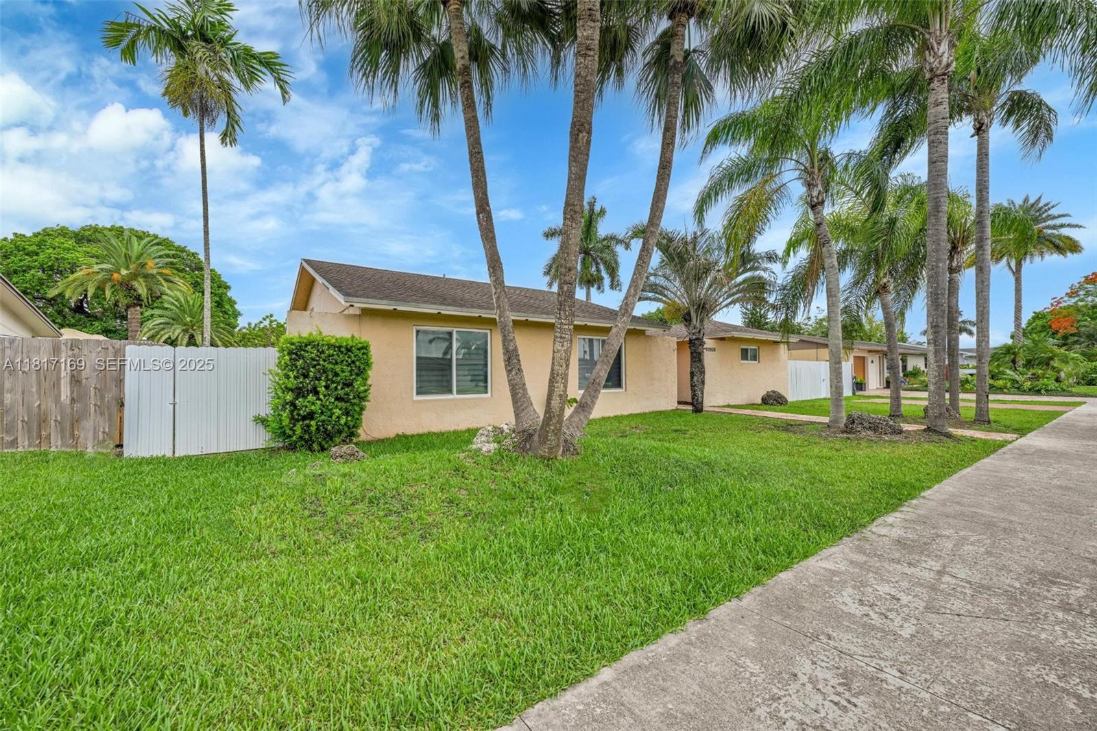 30930 Southwest 190th Avenue Homestead, FL 33030 - Photo 33 of 36 a view of a yard with a palm trees