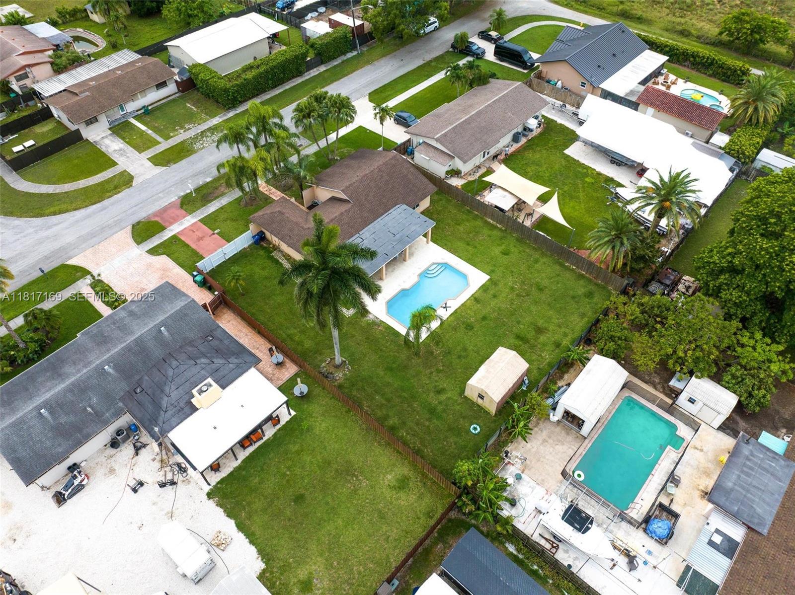 30930 Southwest 190th Avenue Homestead, FL 33030 - Photo 35 of 36 an aerial view of a house with a swimming pool yard and outdoor seating