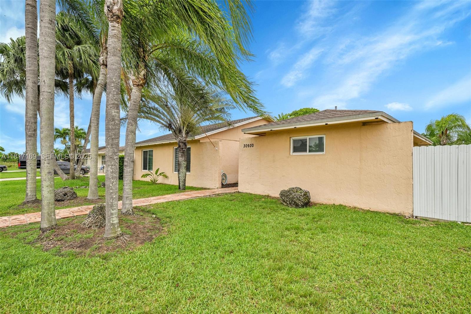 30930 Southwest 190th Avenue Homestead, FL 33030 - Photo 4 of 36 a view of a house with backyard and trees