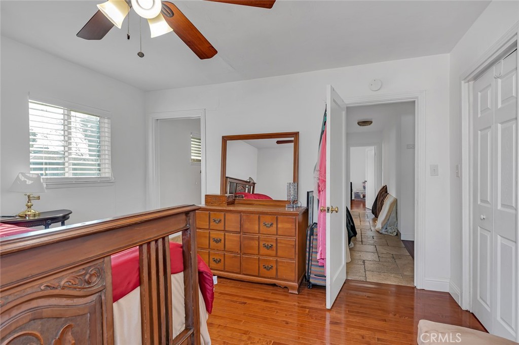 598 East 19th Street Merced, CA 95340 - Photo 11 of 25 a view of a hallway with wooden floor and staircase