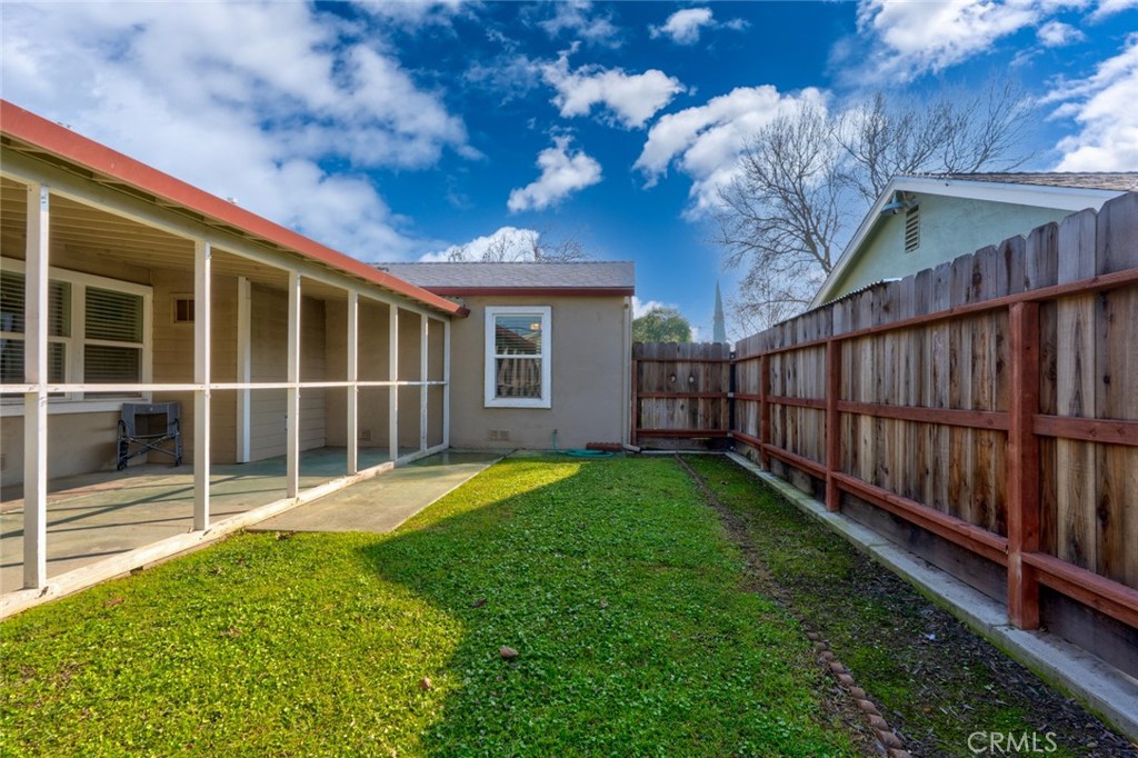 598 East 19th Street Merced, CA 95340 - Photo 24 of 25 a view of a backyard with a garden and deck