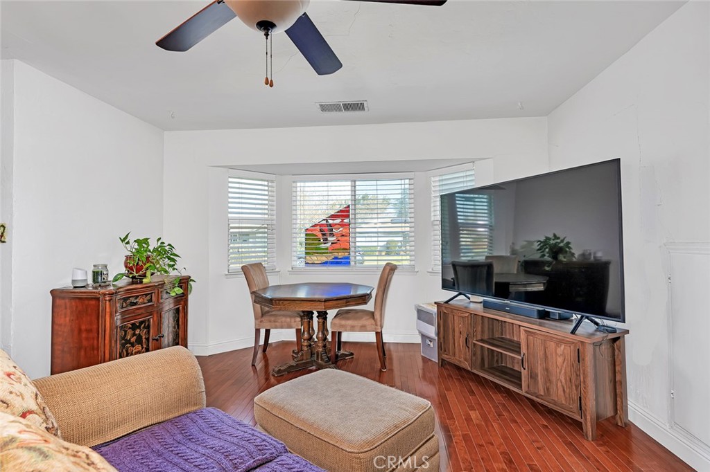 598 East 19th Street Merced, CA 95340 - Photo 8 of 25 a living room with furniture and a flat screen tv