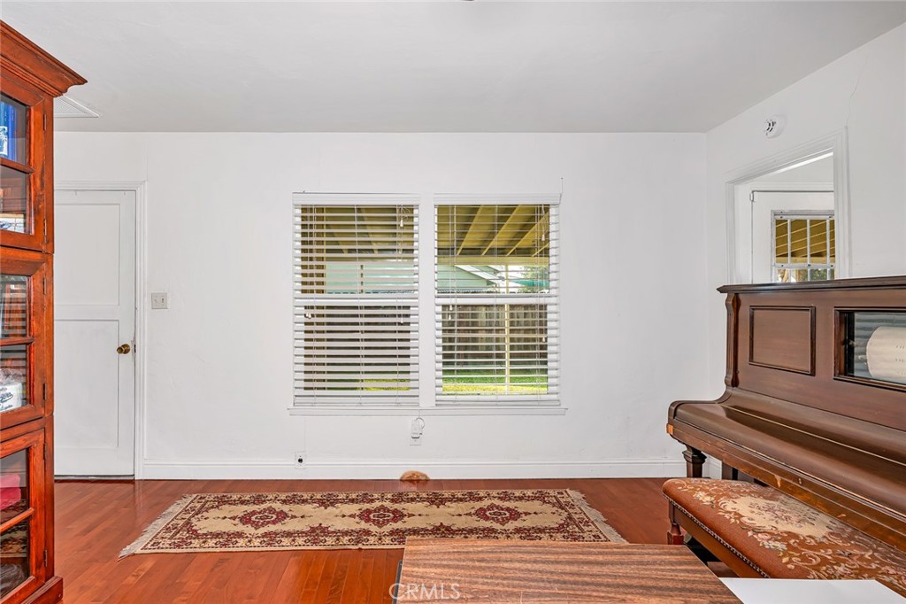 598 East 19th Street Merced, CA 95340 - Photo 9 of 25 a view of a livingroom with wooden floor and a window