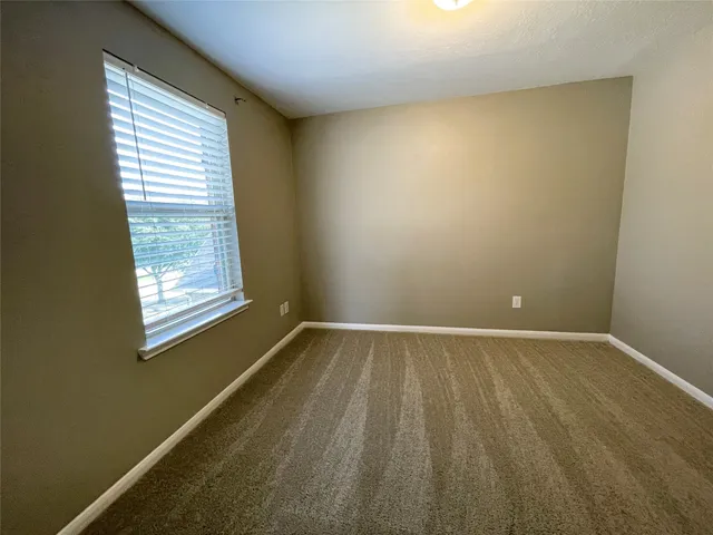 a view of gallery with wooden floor