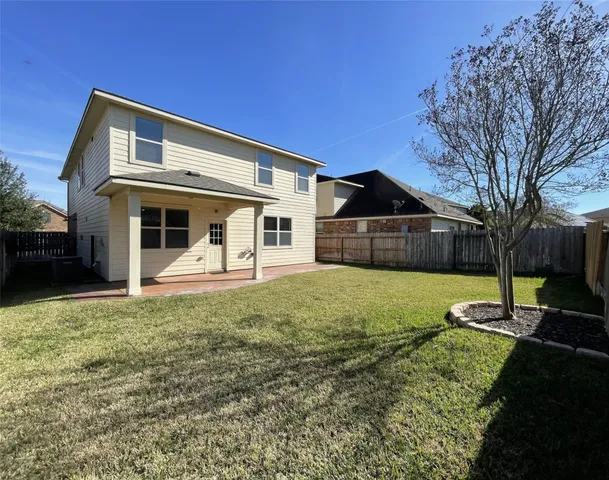 a view of a backyard of the house