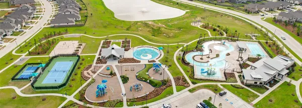 a view of a house with backyard and trees