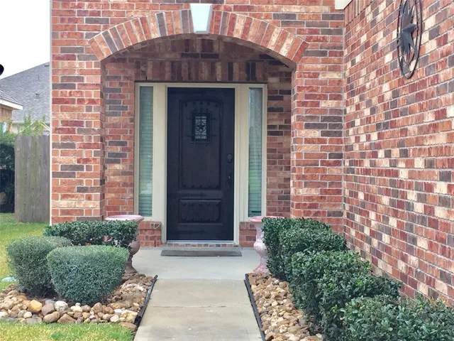 a front view of a house with yard