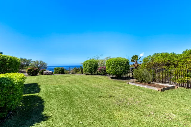 a view of a swimming pool with wooden floor