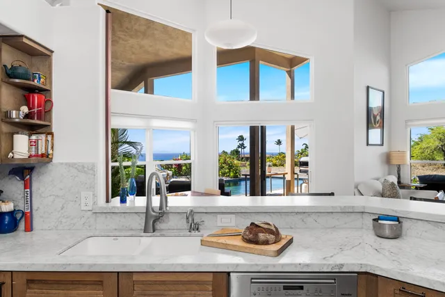 a kitchen with sink and a window