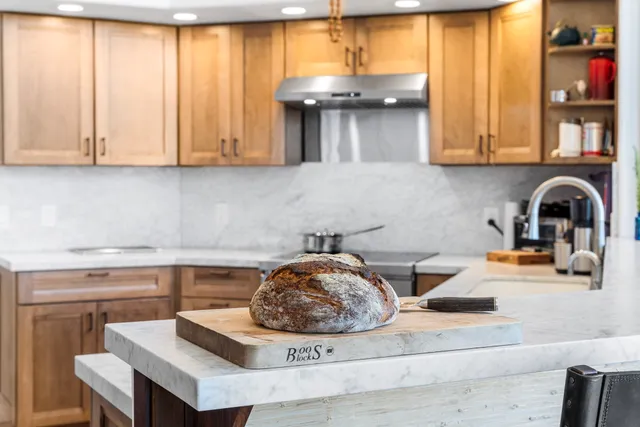 a kitchen with a sink cabinets and window