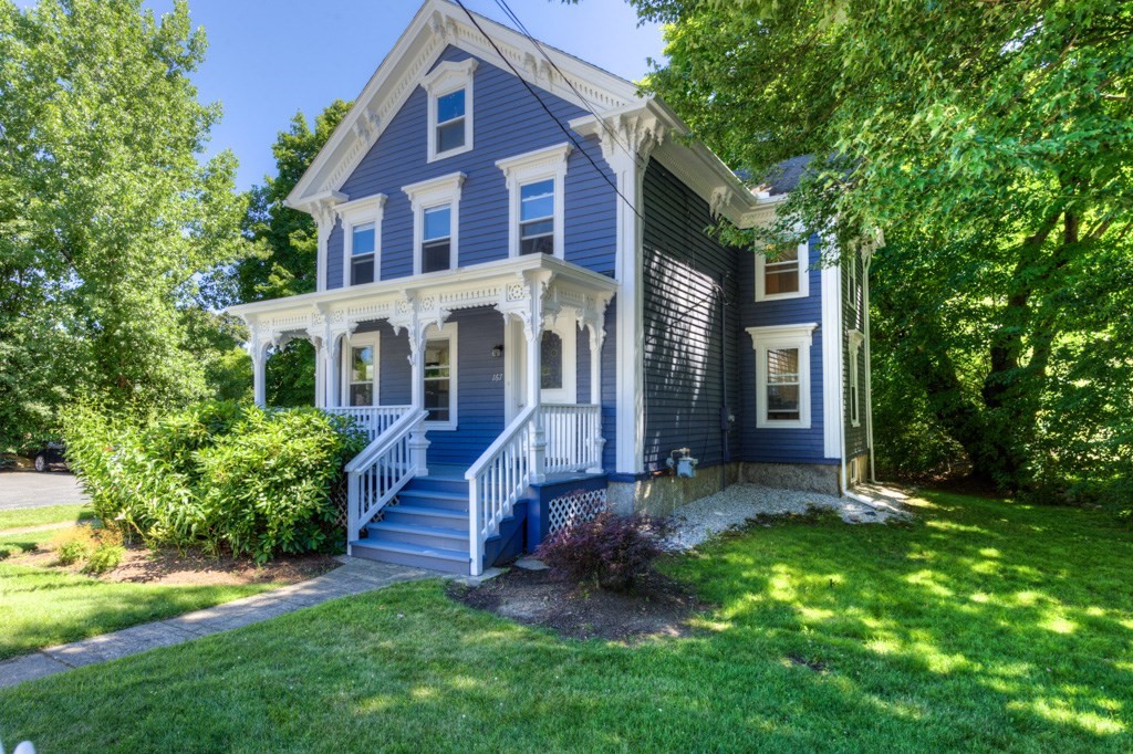 167 Worcester Street Grafton, MA 01536 - Photo 2 of 42 a view of a brick house with a big yard plants and large trees