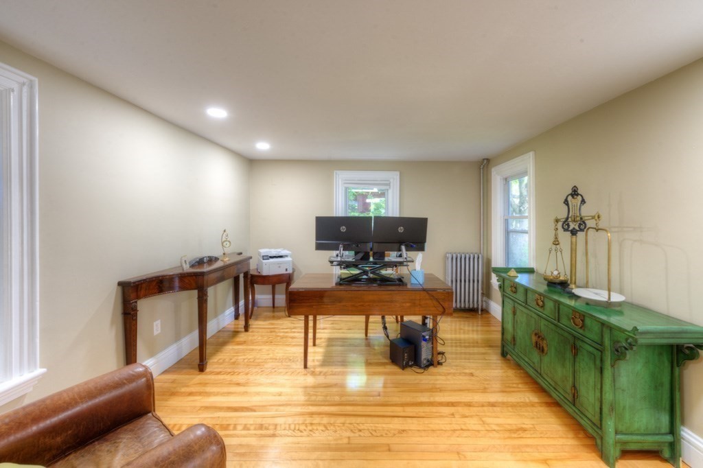 167 Worcester Street Grafton, MA 01536 - Photo 22 of 42 a living room with furniture a dining table and a fireplace