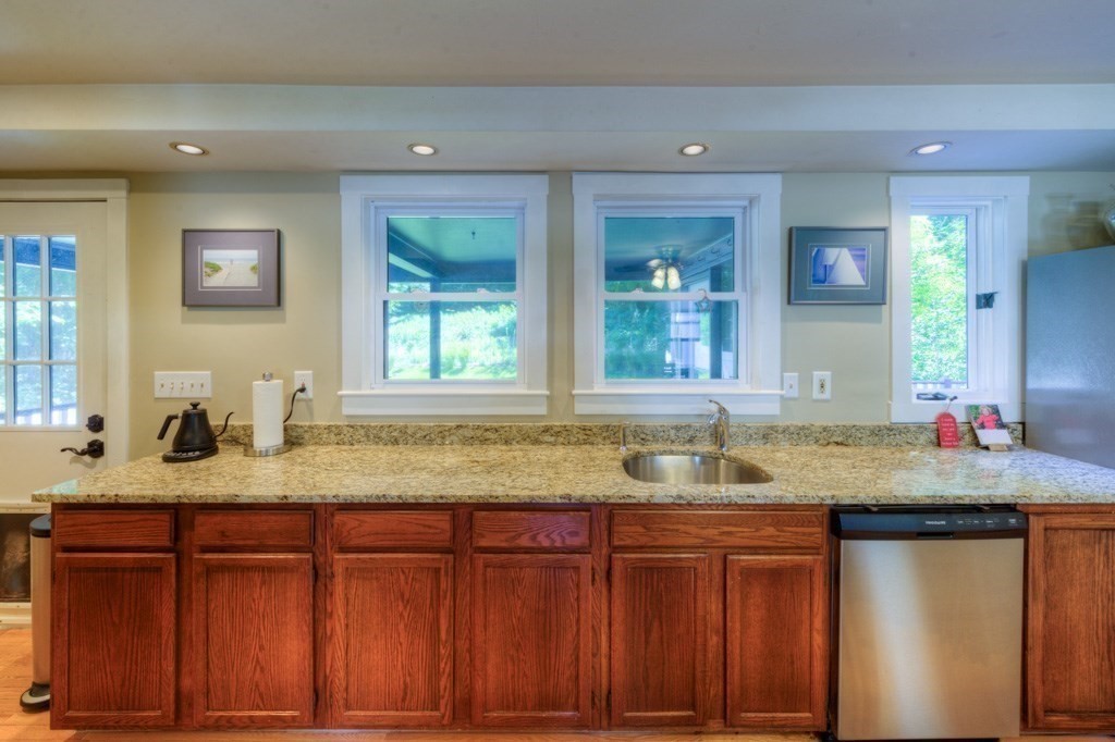 167 Worcester Street Grafton, MA 01536 - Photo 29 of 42 a bathroom with a granite countertop sink and a mirror