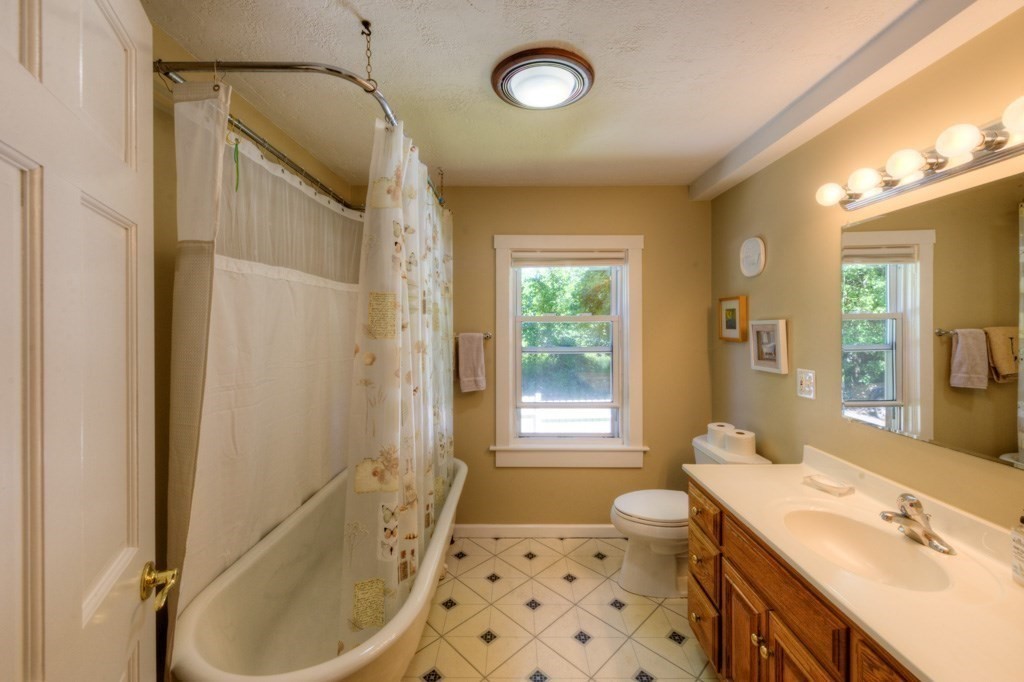 167 Worcester Street Grafton, MA 01536 - Photo 31 of 42 a bathroom with a granite countertop sink toilet and shower