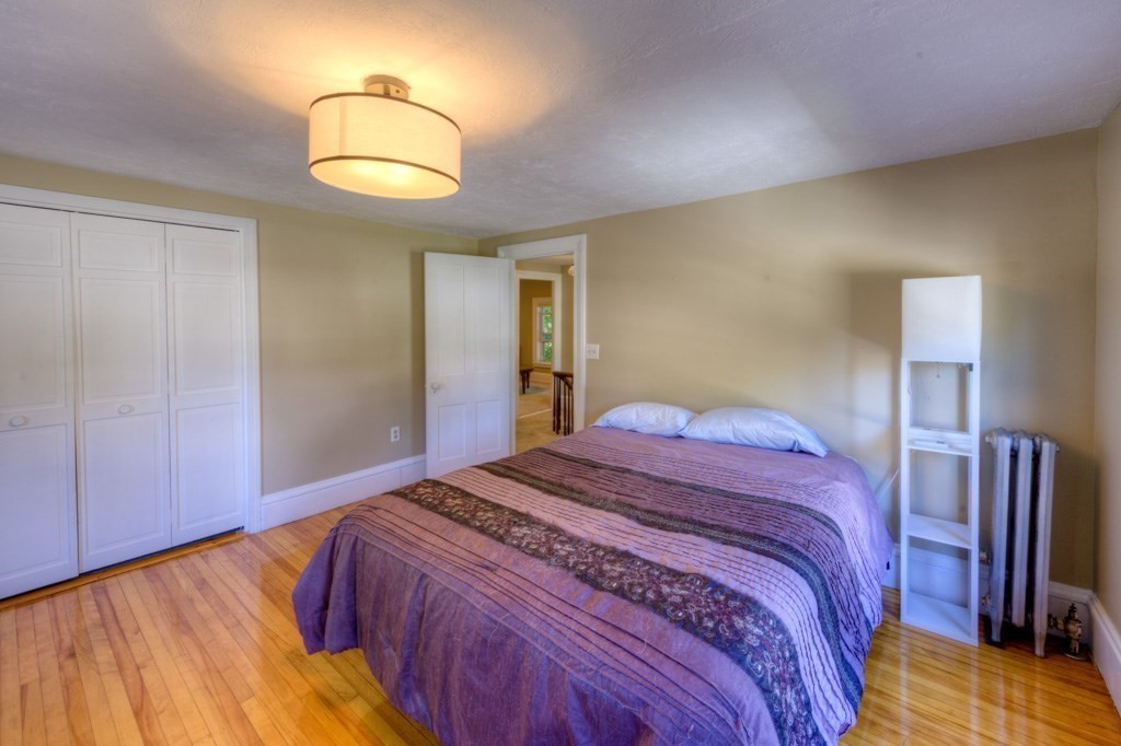 167 Worcester Street Grafton, MA 01536 - Photo 38 of 42 a bedroom with a bed and closet