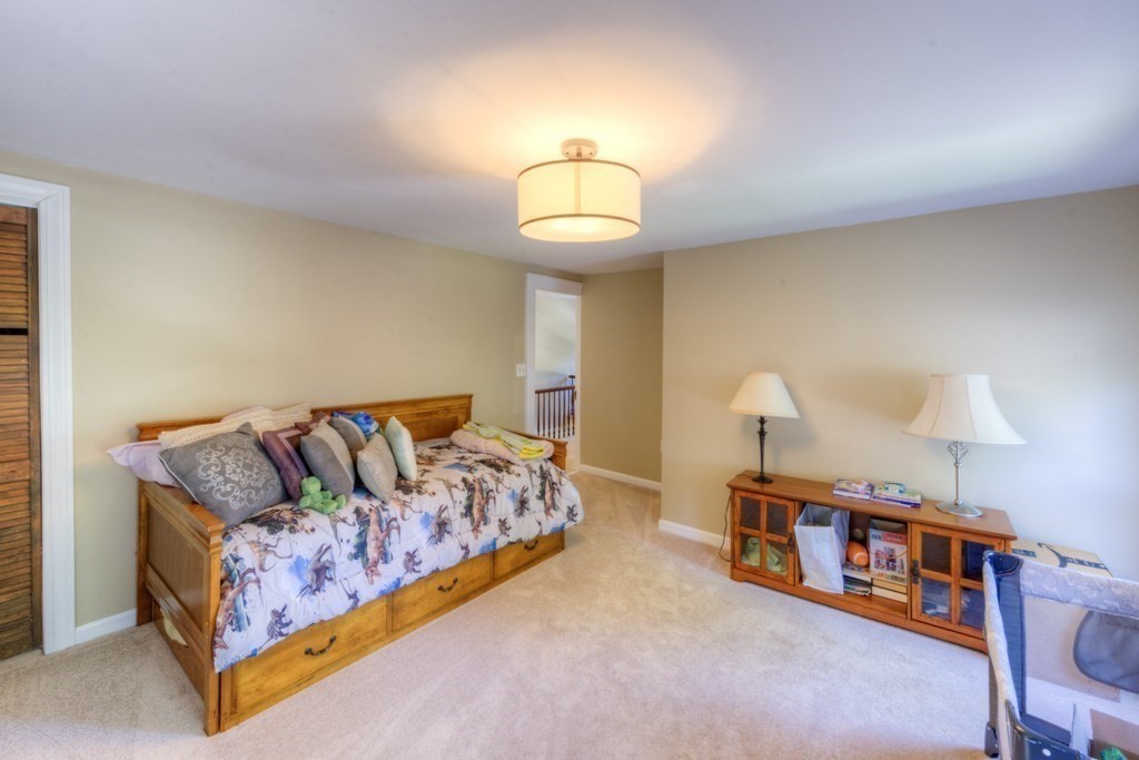 167 Worcester Street Grafton, MA 01536 - Photo 40 of 42 a living room with furniture and a lamp