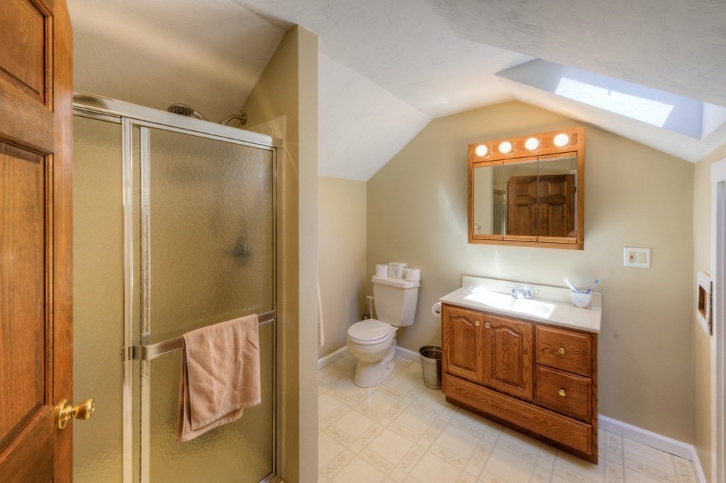 167 Worcester Street Grafton, MA 01536 - Photo 42 of 42 a bathroom with a toilet a sink and a mirror