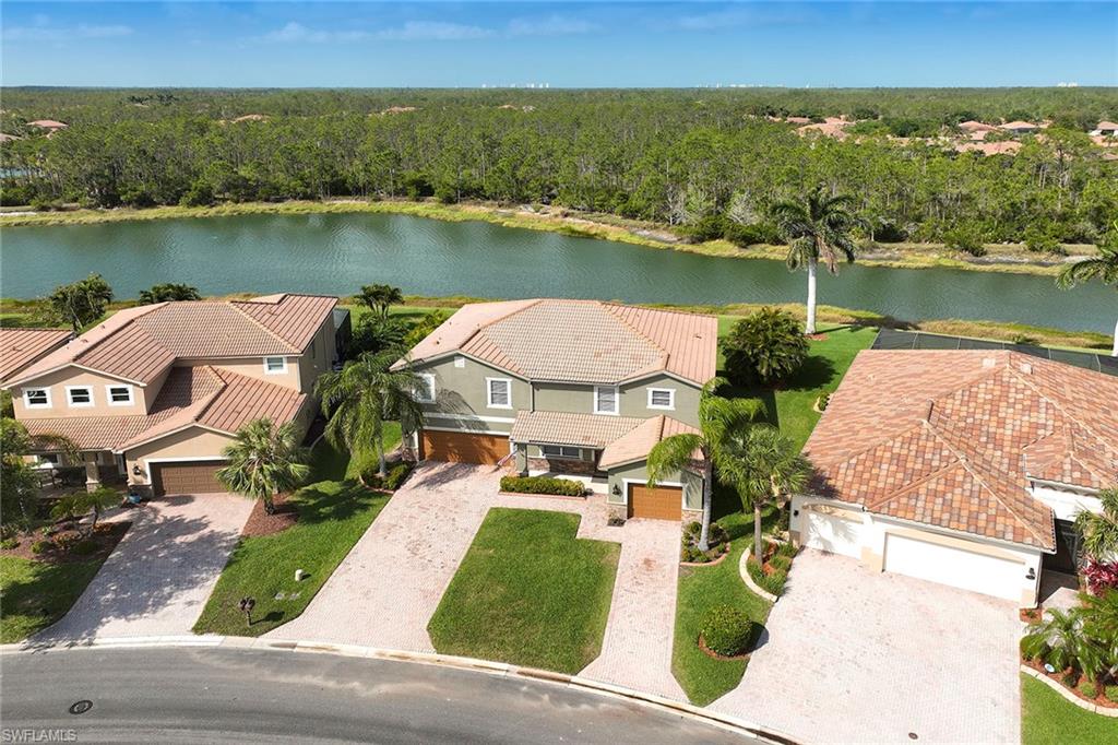 21651 Bella Terra Boulevard Estero, FL 33928 - Photo 3 of 40 an aerial view of a house with outdoor space lake view and mountain view