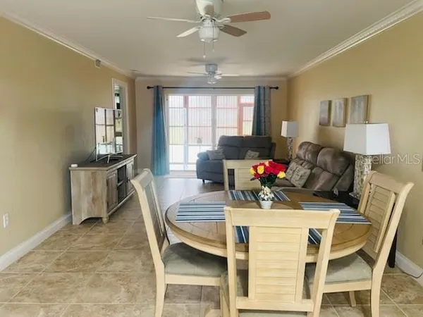 a view of a dining room with furniture and window