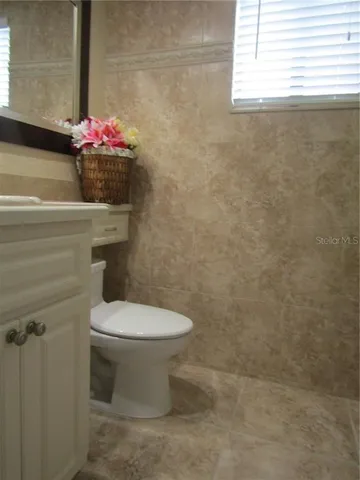 a bathroom with a toilet and a sink