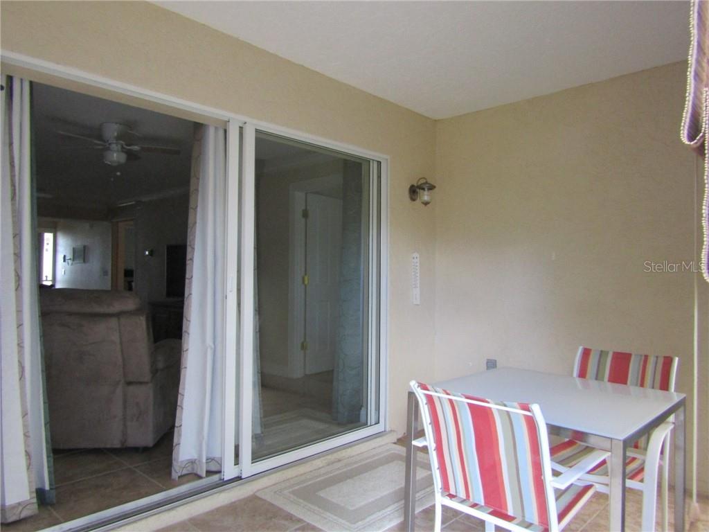 1211 Saxony Circle, Unit A1 Punta Gorda, FL 33983 - Photo 10 of 13 a room that has a bed and a dresser in it