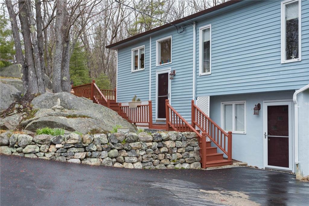 Gracious garden entry with stone wall